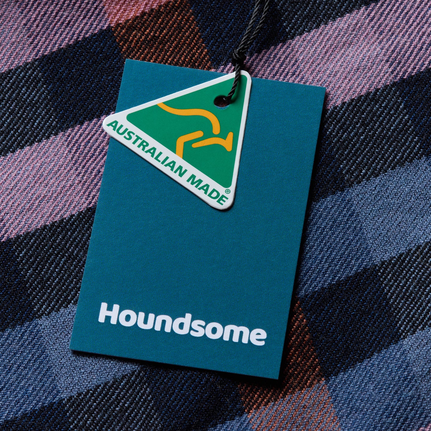 Galah merino wool fabric close up with Australian made logo and houndsome swing ticket